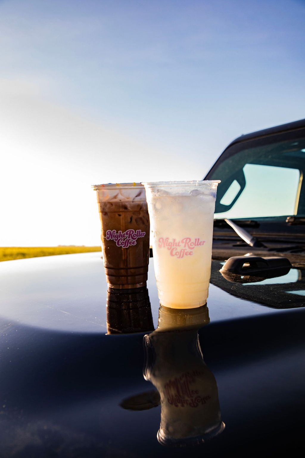Signature iced latte on a car hood